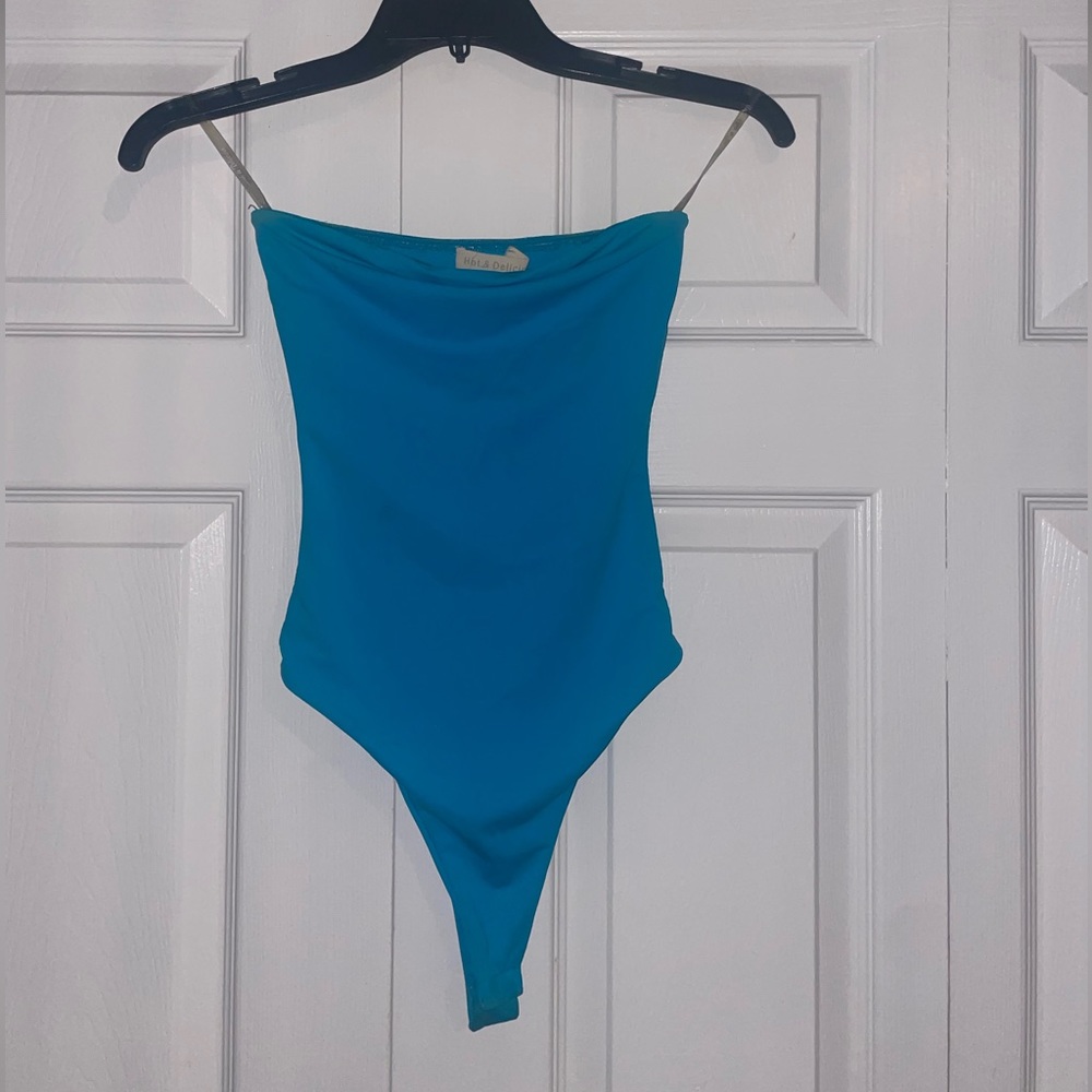 Bright turquoise tube top bodysuit from a local boutique! Size S but can fit XS!